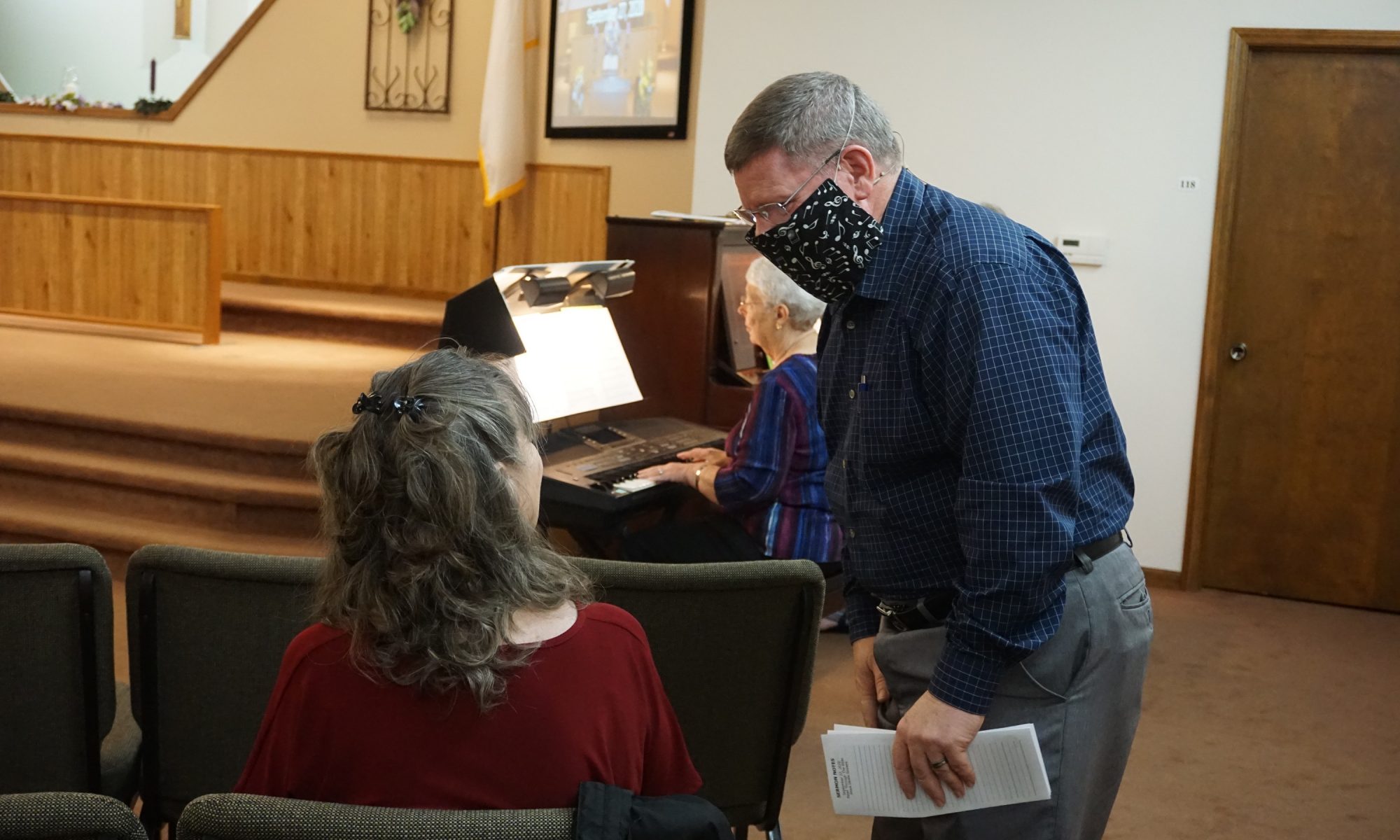 Pastor greeting a visitor during COVID days